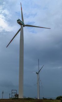 Low angle view of wind turbine against sky