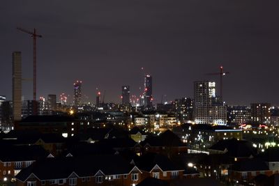 Illuminated buildings in city at night