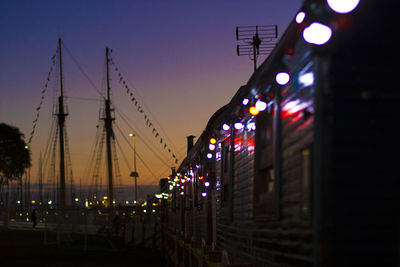 Illuminated city waterfront at night