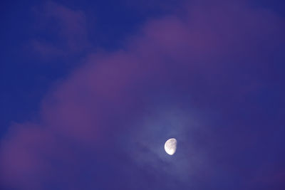 Low angle view of moon against sky at night