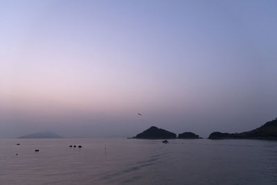 Scenic view of sea against sky during sunrise 