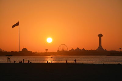 Scenic view of sea against orange sky