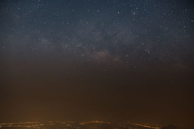 Low angle view of sky against star field at night