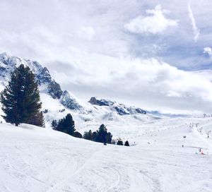 Scenic view of snow covered mountains against sky