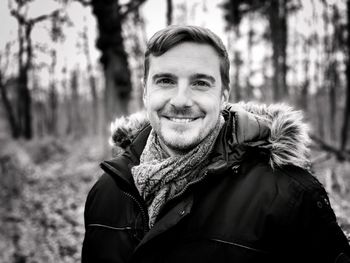 Portrait of smiling man in forest