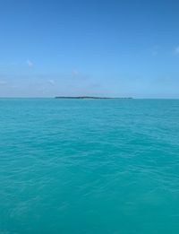 Scenic view of sea against blue sky