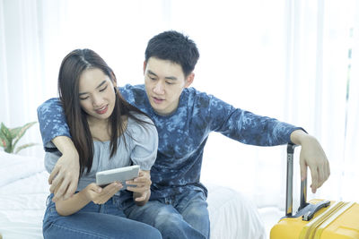 Young couple looking at camera