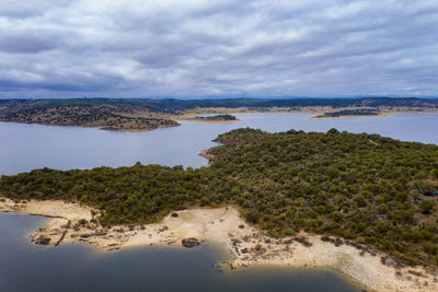 Drone aerial view of idanha dam marechal carmona landscape with lake water, in portugal