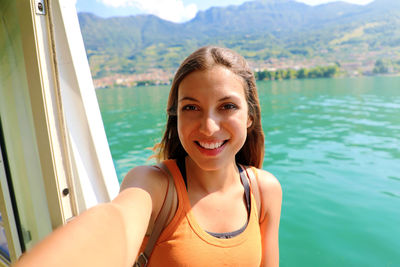 Portrait of a smiling young woman in water