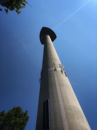 Low angle view of modern building against blue sky