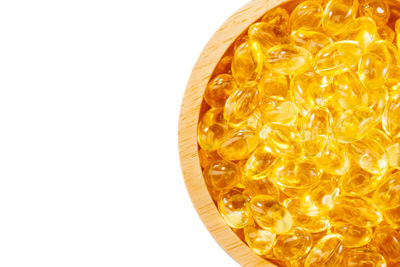 High angle view of orange fruit against white background