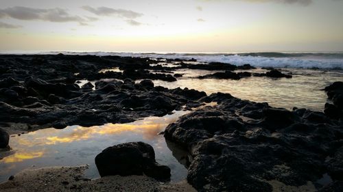 Scenic view of sea at sunset