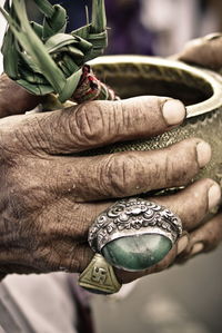 Close-up of hand holding cigarette