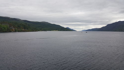 Scenic view of sea against cloudy sky