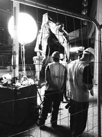 People in illuminated room