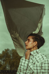 Portrait of young man looking away