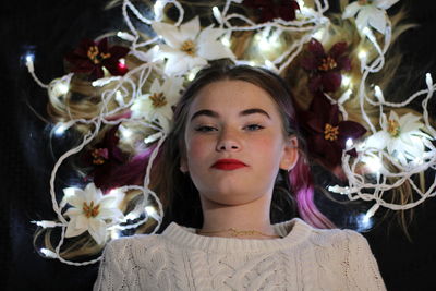 Portrait of girl laying in lights