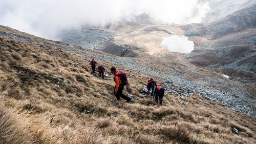 People walking on mountain landscape