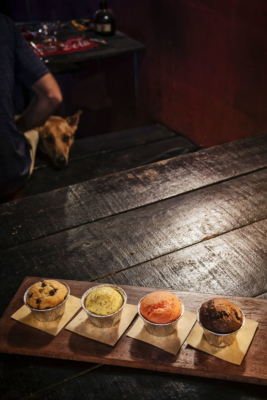 LOW SECTION OF MAN ON TABLE IN KITCHEN