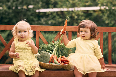 Cute girls sitting outdoors