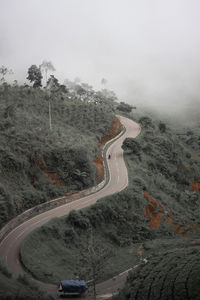 High angle view of road amidst mountains