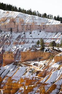 Close up telephoto zoom photo of bryce canyon national park hillside with texture lit by sun