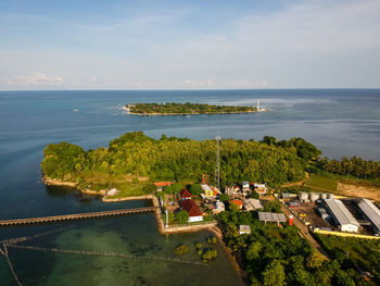 High angle view of swimming pool by sea against sky