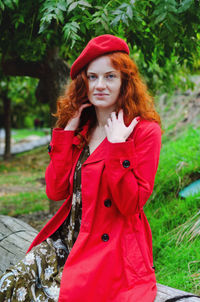 Young happy woman with red hair, freckles, blue eyes in beret in autumn park, smiling. lifestyle