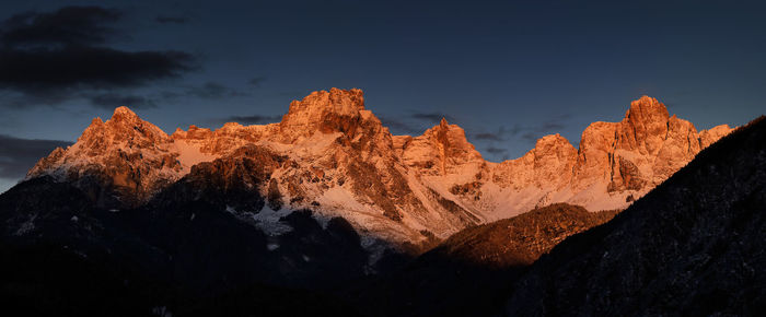 Low angle view of snowcapped mountain against sky during sunset