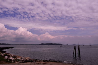 Scenic view of sea against cloudy sky