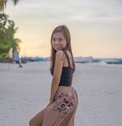 Portrait of a smiling young woman on beach