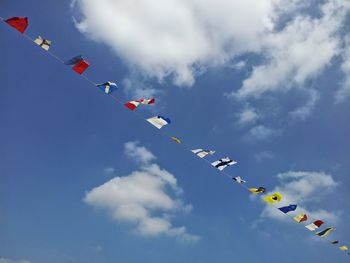 Low angle view of airshow against sky