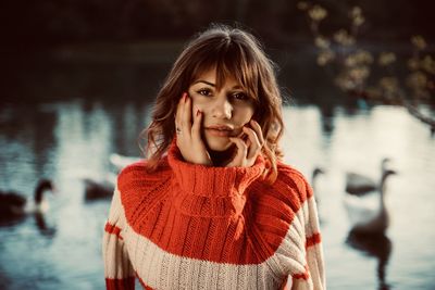 Portrait of young woman standing in water