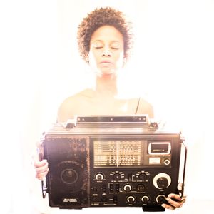 Portrait of woman photographing against white background