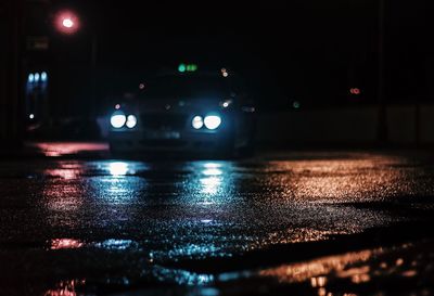 Surface level of wet road at night