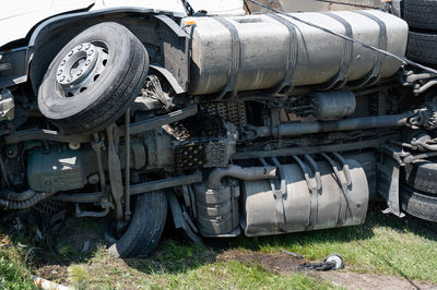 Close-up of abandoned truck on field