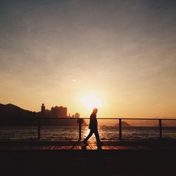 Silhouette of people at sunset