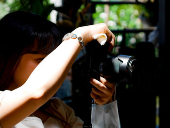 Portrait of woman photographing