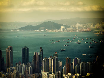 Scenic view of sea and buildings against sky