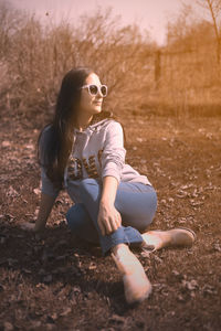 Woman sitting on field