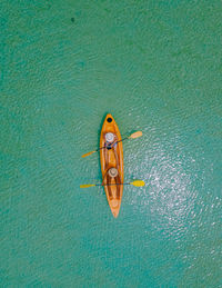 Men and women in kayak in the ocean of the tropical island of koh mak thailand