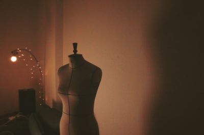 Mannequin in illuminated room