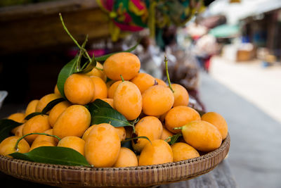 Close-up of fruits in basket for sale at market stall