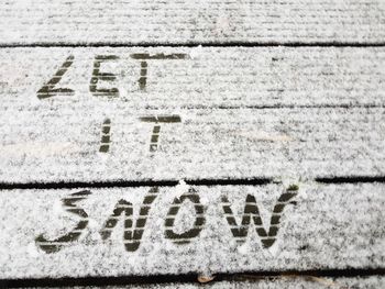 Close-up of text on snow