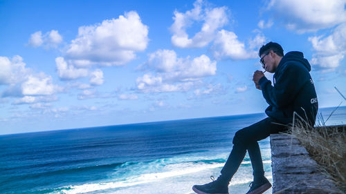 Man on beach against sky