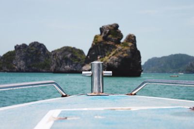 Close-up of swimming pool by sea against clear sky