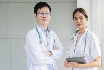 Portrait of female doctor standing in hospital