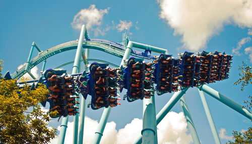 Low angle view of carousel against sky