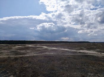 Scenic view of land against sky