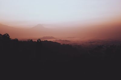 Scenic view of silhouette landscape against sky during sunset